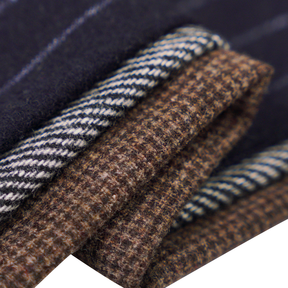 50 % laine, 30 % polyester, 20 % autres fibres, 320 G/M, blanc cassé + noir, tissu en flanelle sergé, ML-C-22104